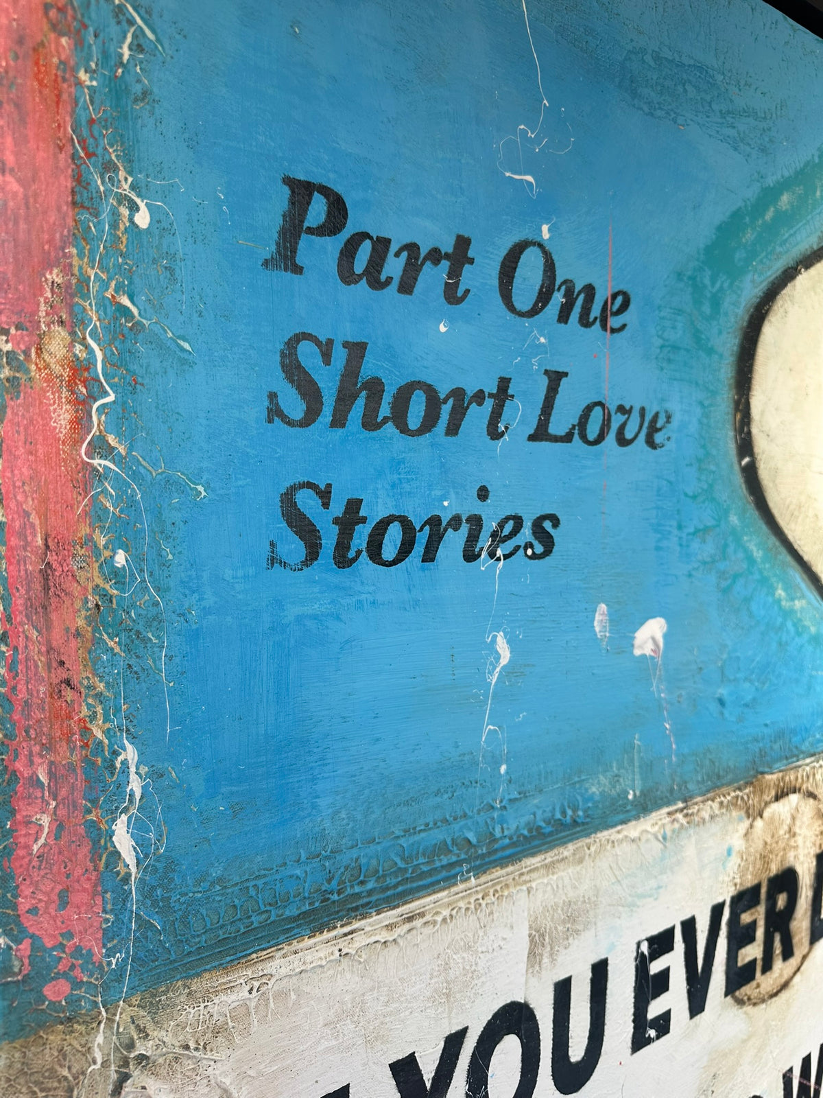 James McQueen 'If You Ever Leave Me' original canvas, detail of the aged 'Part One Short Love Stories' book-cover text in blue mixed-media surface. Creed Gallery, Ascot.