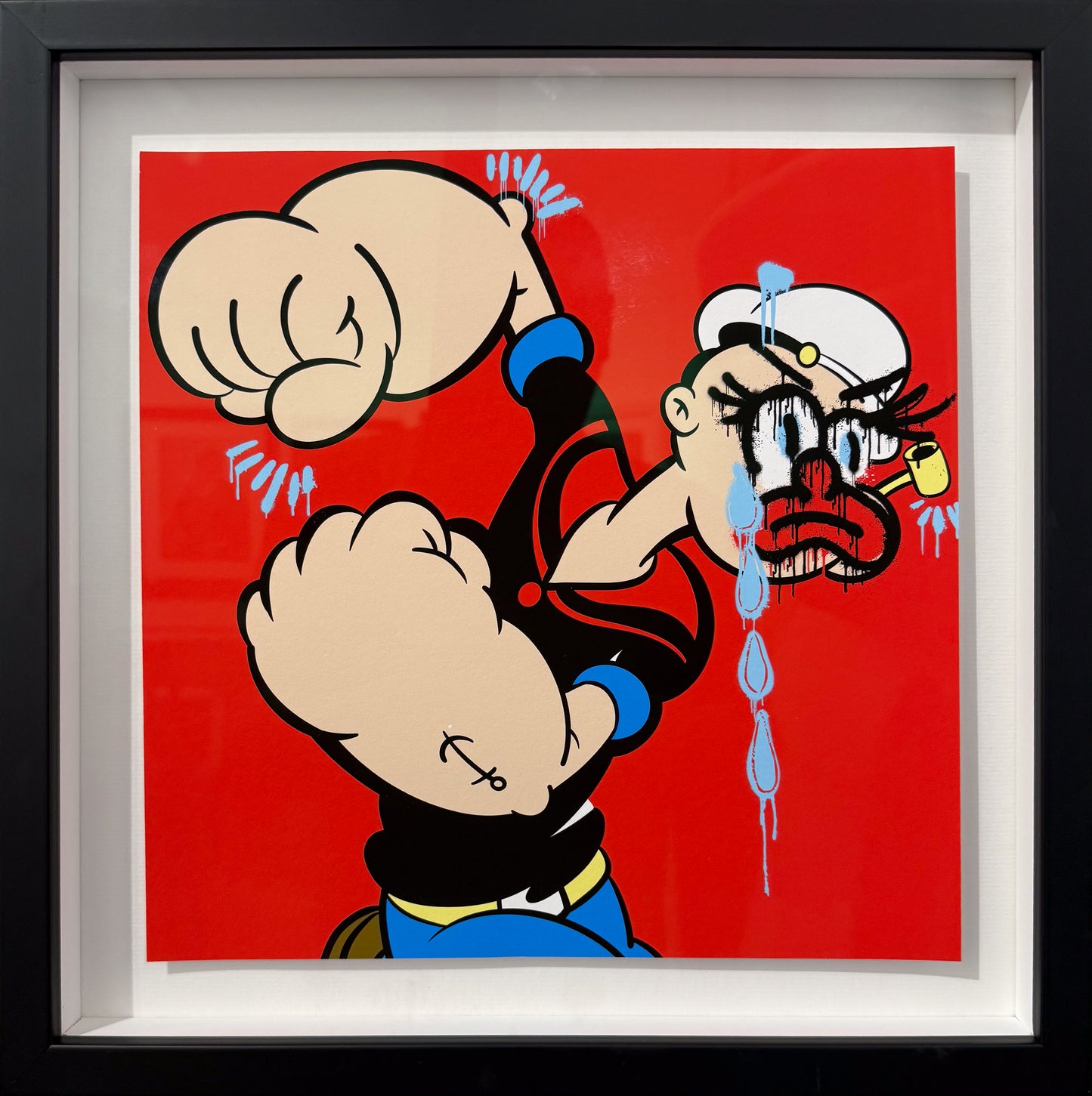 Slawn Popeye artwork, featuring a flexing sailor with a red nose and blue tears on a bold red background, framed. Available at Creed Gallery in Ascot.