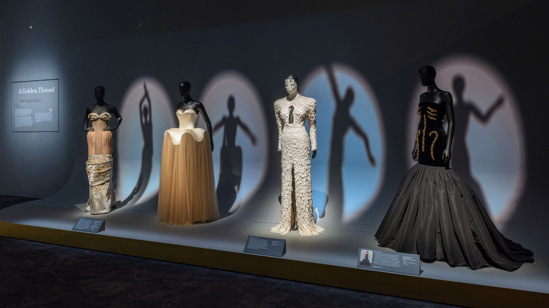Interior view of the Schiaparelli Fashion Becomes Art exhibition at the V&A Museum featuring surrealist haute couture and 2026 art-to-wear trends.