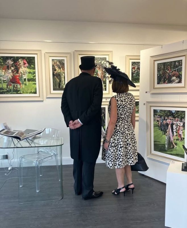 A sophisticated couple in formal race day attire, including a top hat and fascinator, viewing equestrian and social scene paintings at Creed Gallery in preparation for Royal Ascot 2026.