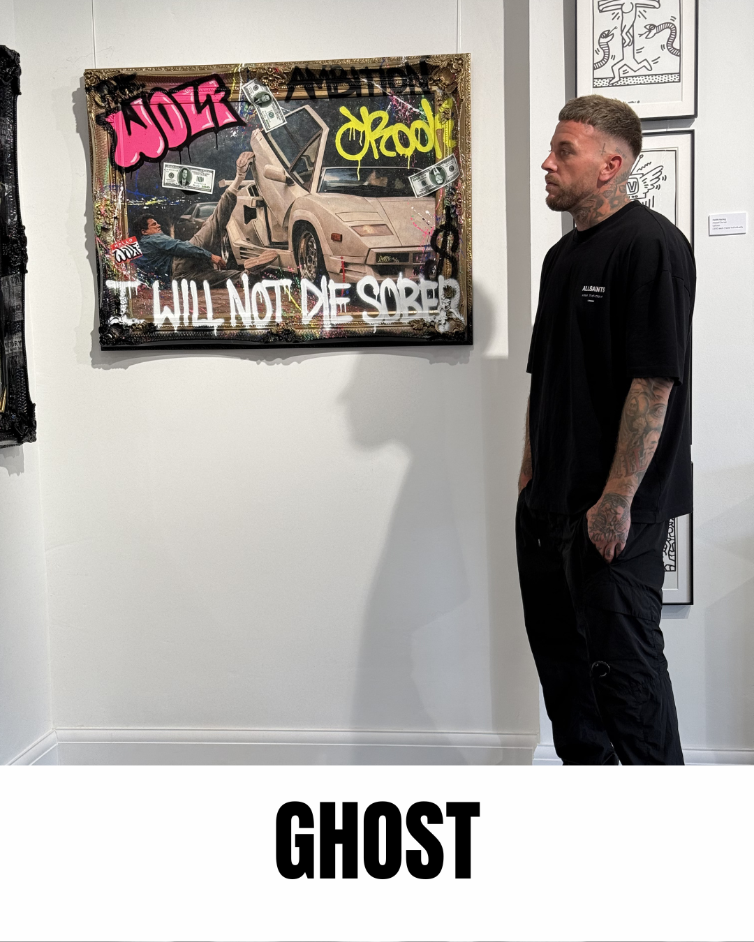 One half of Ghost collective photographed beside their work I Will Not Die Sober at a gallery exhibition