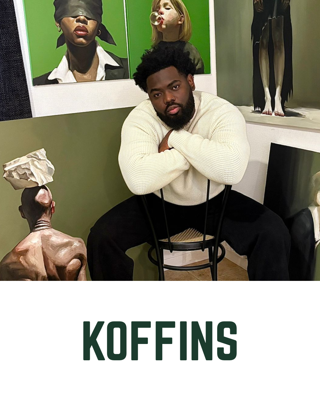 Portrait of artist Koffins in his studio for the ‘Holding the Sky’ UK debut exhibition at Creed Gallery, Ascot, seated in front of several contemporary figurative paintings featuring bold green backgrounds.