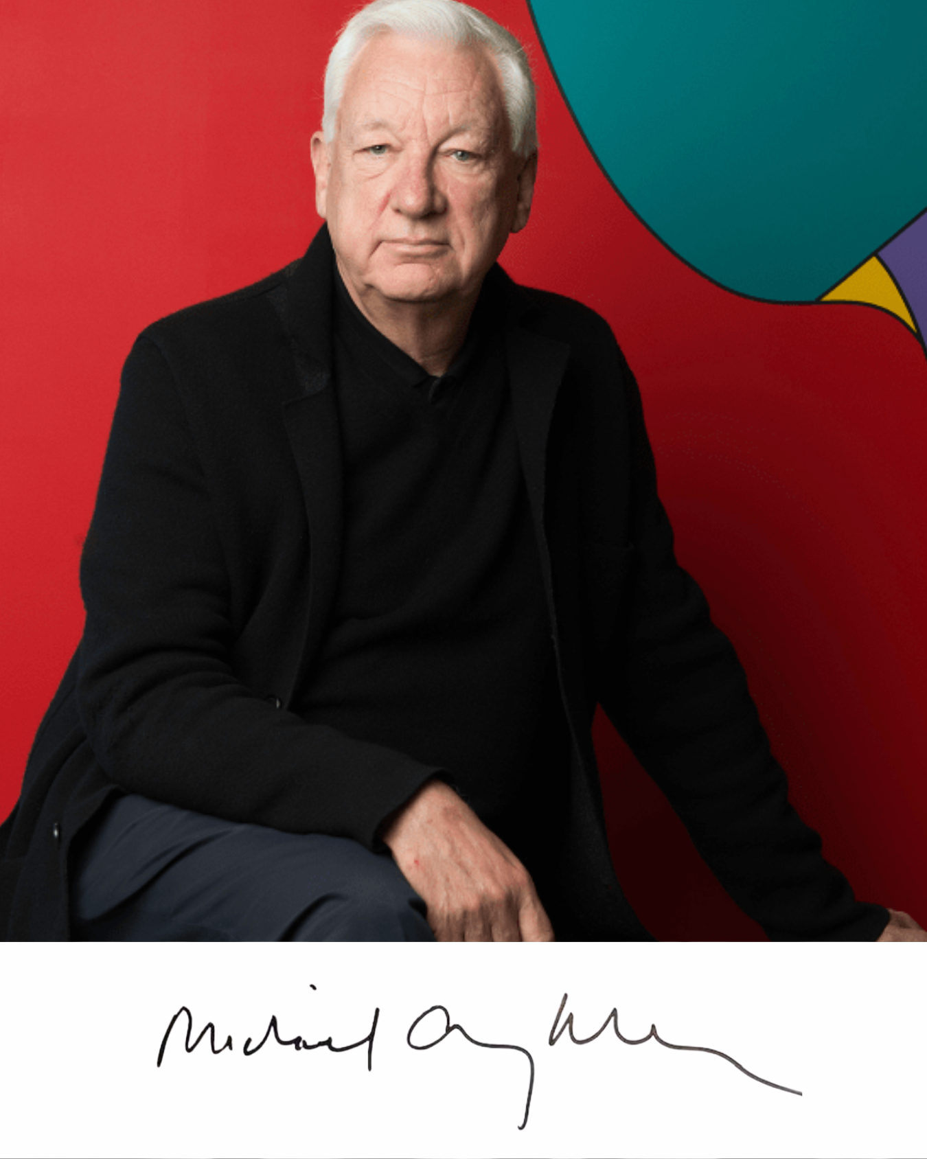 Sir Michael Craig-Martin photographed against his signature bold flat colour work, with his handwritten signature below