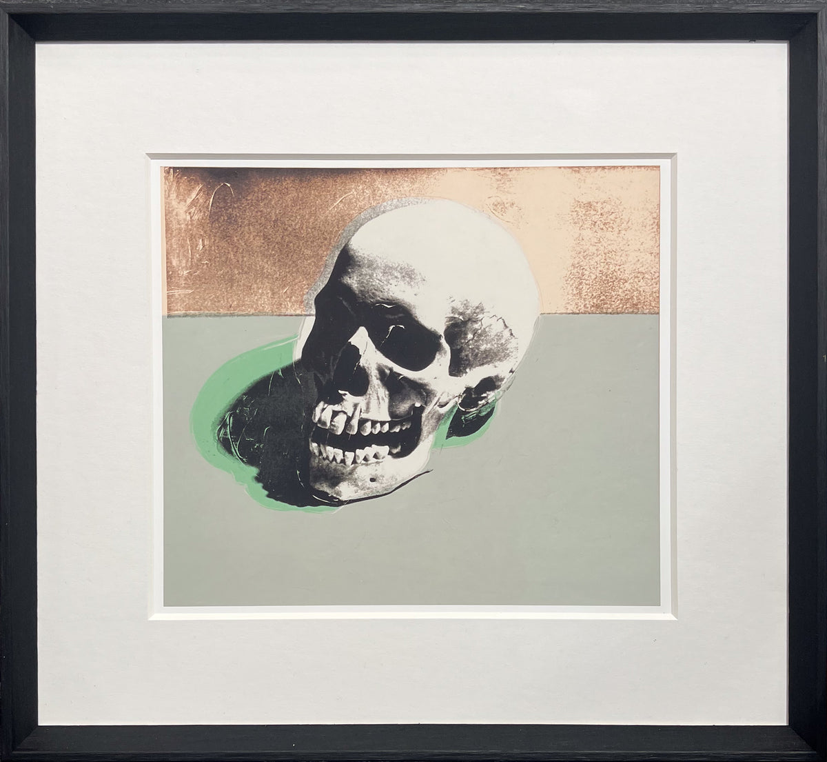 After Warhol print of a human skull in flat Pop colour with a green cast shadow, from the 1976 Skulls series, framed
