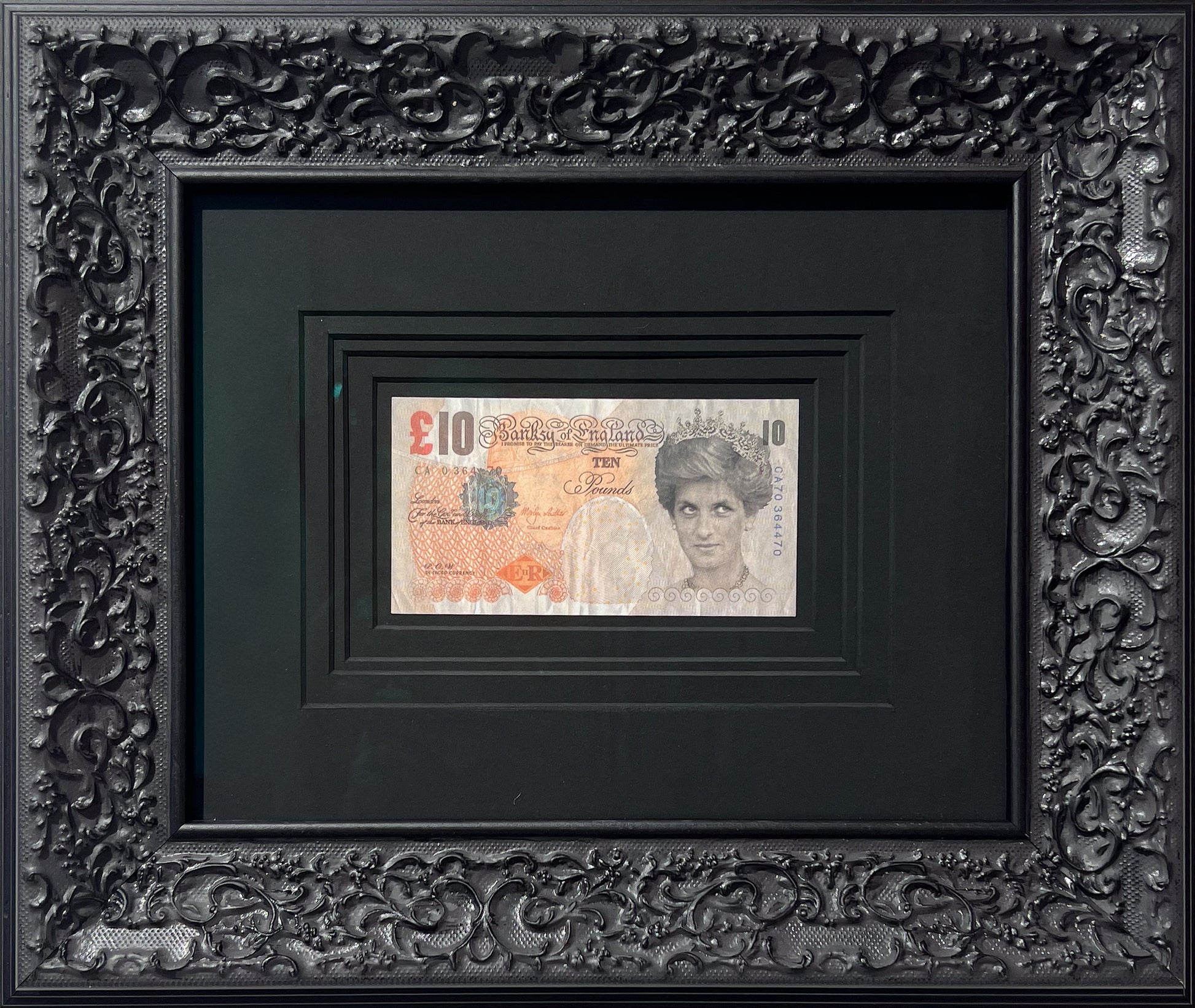 Authentic Banksy Di-Faced Tenner note from 2004, featured in an ornate black Baroque frame at Creed Gallery Ascot, serving Berkshire, Surrey, and London.