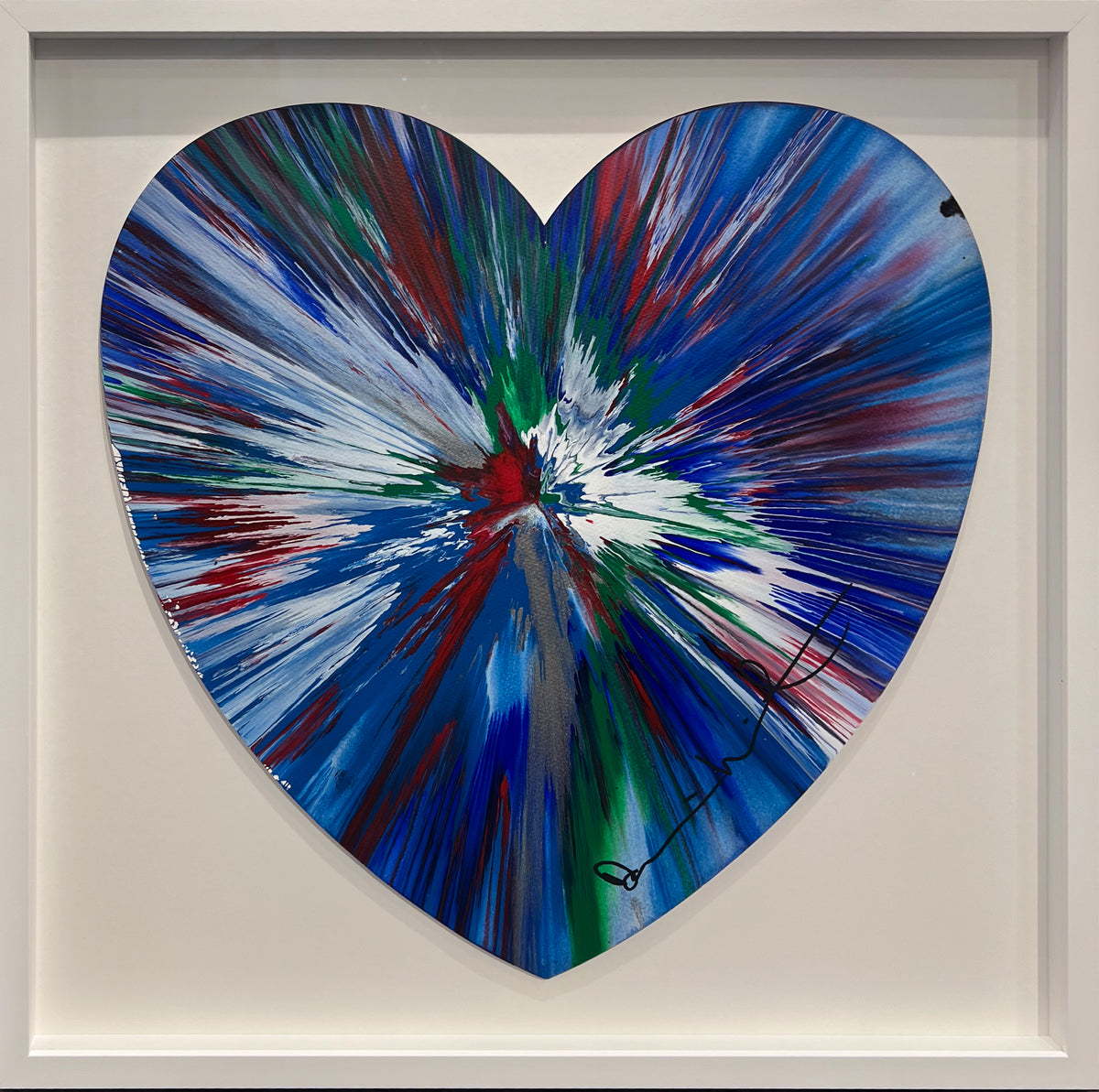 Damien Hirst heart-shaped spin painting in blue and white with red and green, signed and framed in white, at Creed Gallery, Ascot
