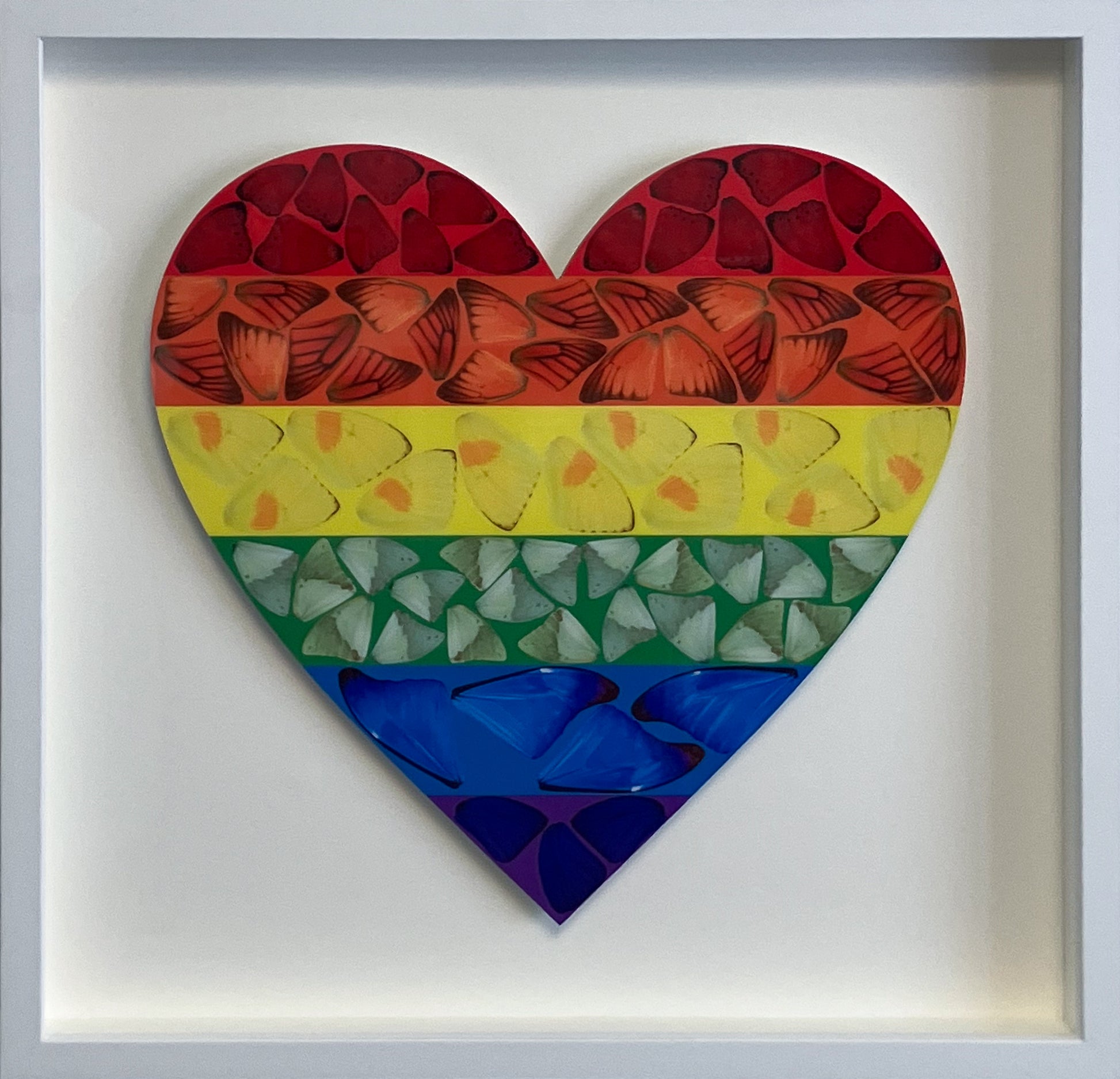 Framed Damien Hirst "Butterfly Heart" (Small) featuring a kaleidoscopic butterfly motif. Elegantly presented in a bespoke gallery frame, ideal for luxury dressing rooms or hallways in the Wentworth Estate and Virginia Water. Available at Creed Gallery Ascot.