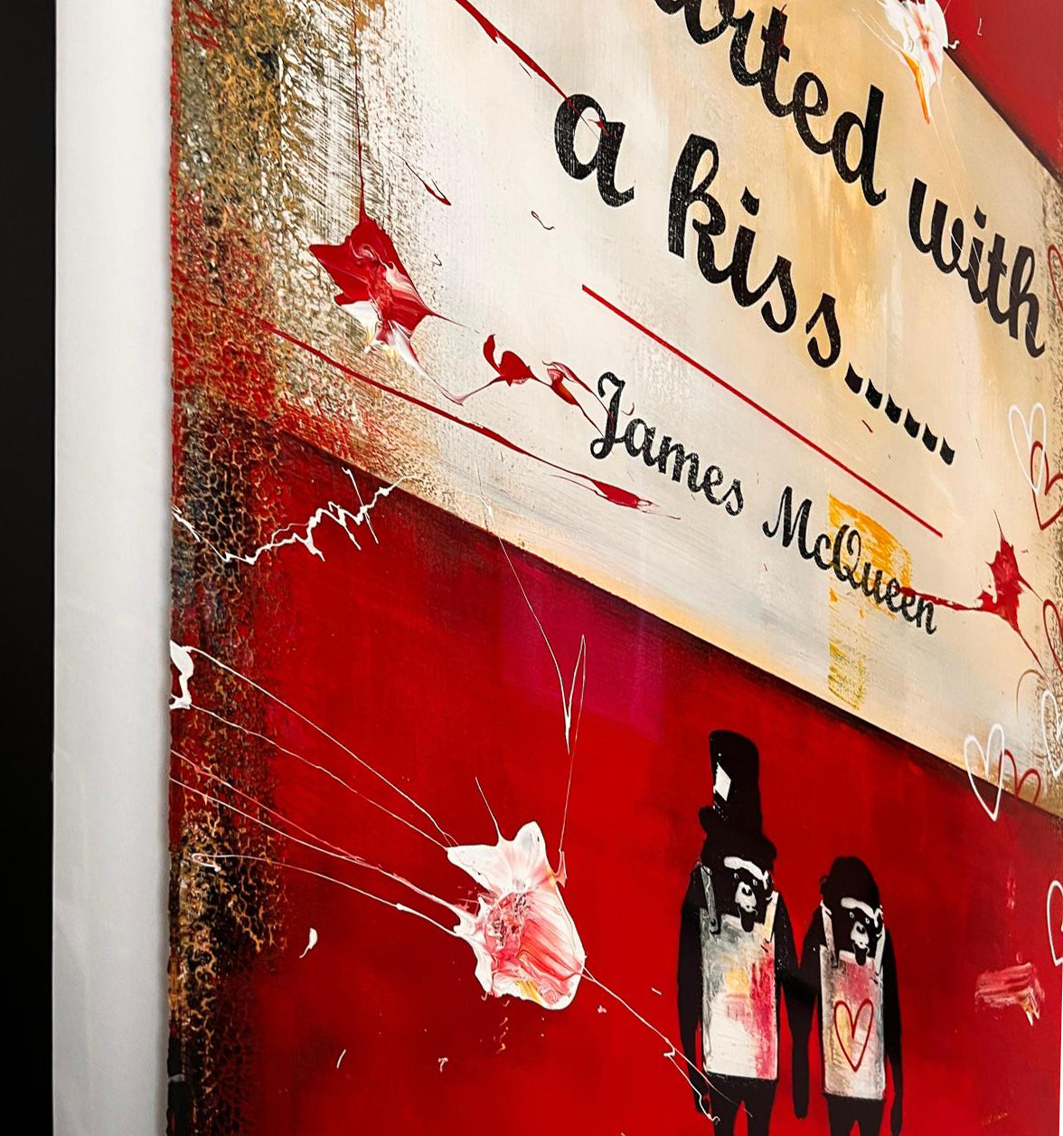 James McQueen 'It Started With A Kiss' unique original painting, detail of the artist's signature paired monkey motif in top hats, holding hands over a red 'Complete and Unabridged' book-cover background. Creed Gallery, Ascot.