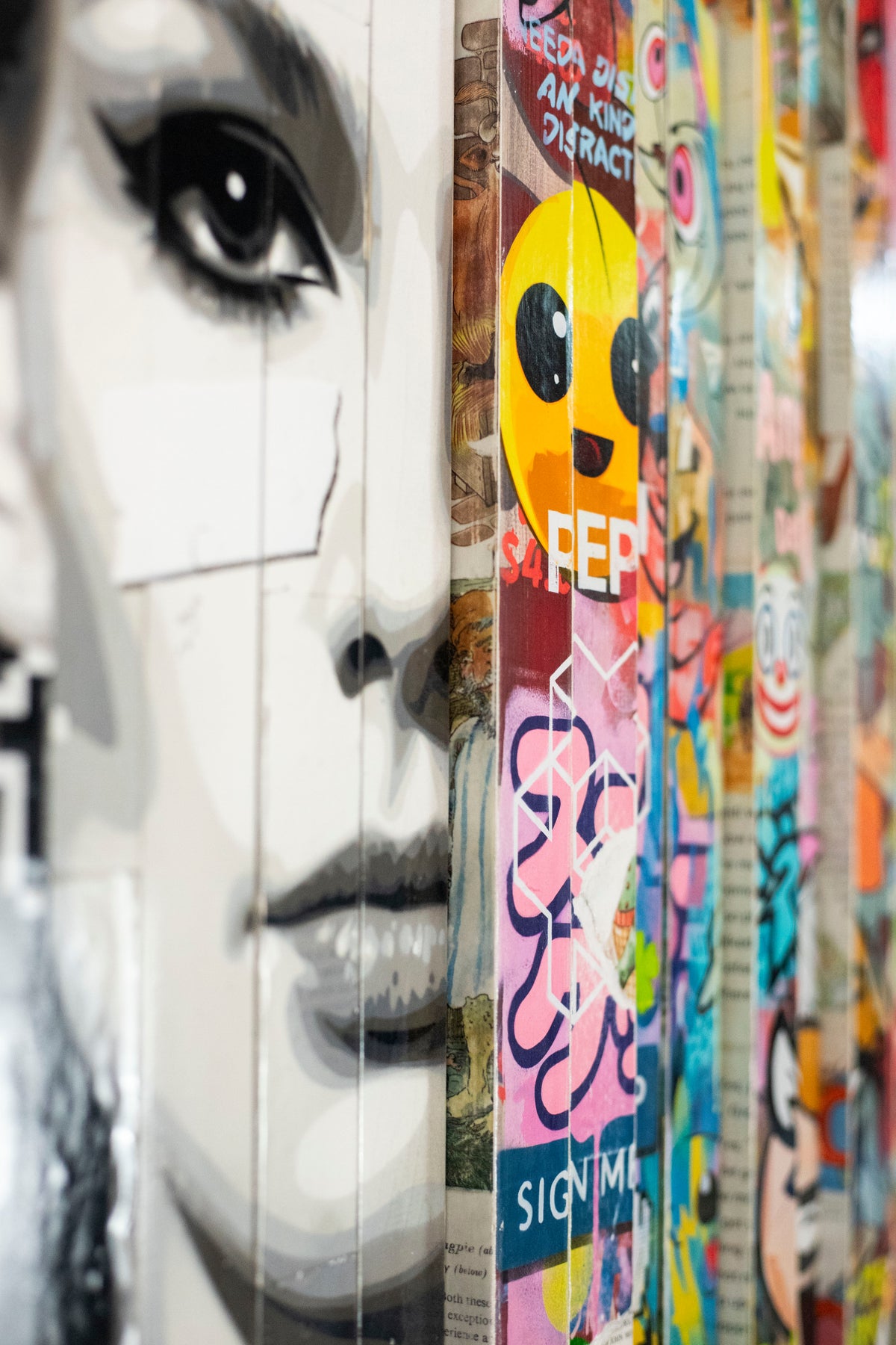 Close-up of the eye and emoji in Lhouette Misfits, a pop art work available at Creed Gallery, Ascot