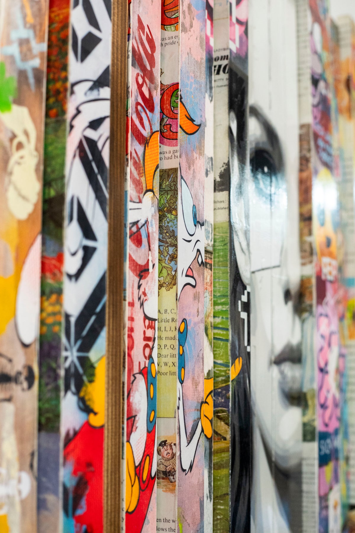 Side detail of Lhouette Misfits showing slat edges, Coca-Cola lettering and the painted face