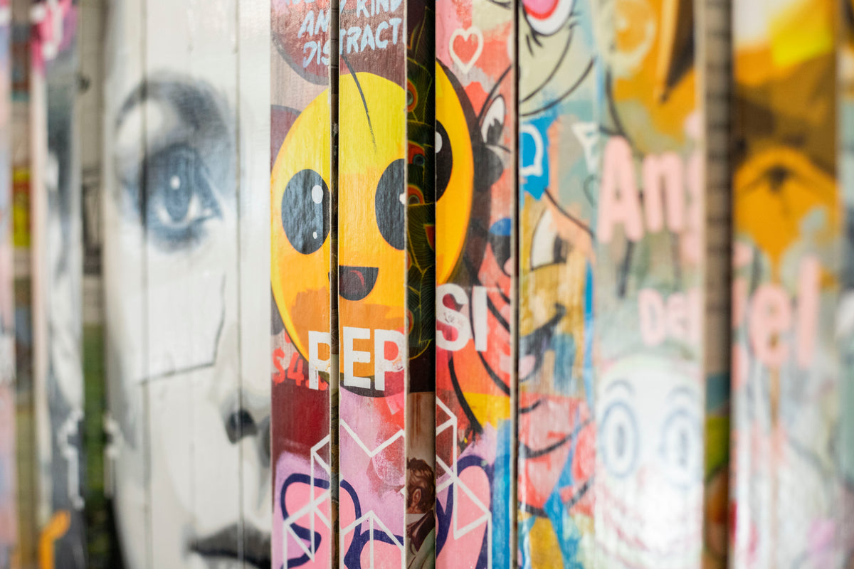 Close angled detail of Lhouette Misfits, the slats layered in front of the face and emoji