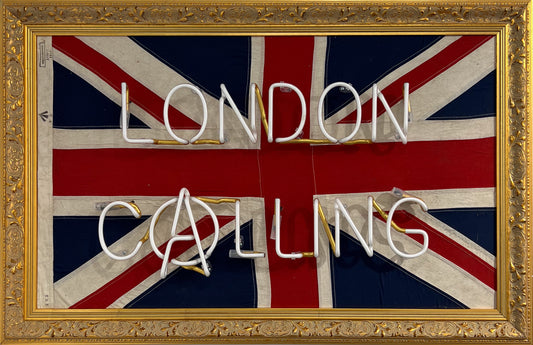 Mark Sloper "London Calling" original neon artwork shown unlit on an authentic vintage 1942 Union Jack flag. Hand-blown glass neon tubing mounted on a historical British flag, available at Creed Gallery Ascot.