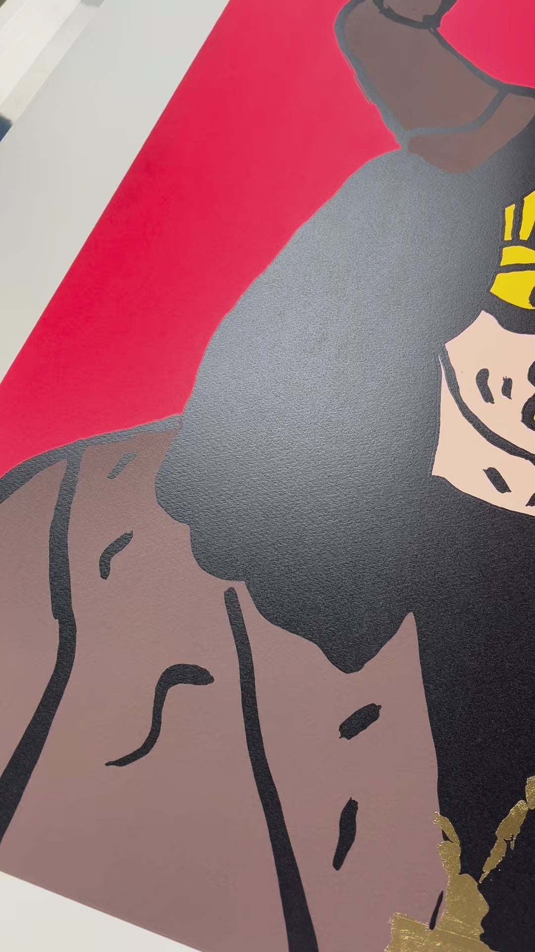 Close-up video showing the texture and ink application of Mason Newman’s Ozzy Osbourne silkscreen print. The footage captures the sophisticated use of colour and "New Pop" lens applied to the heavy metal icon for the charity release.