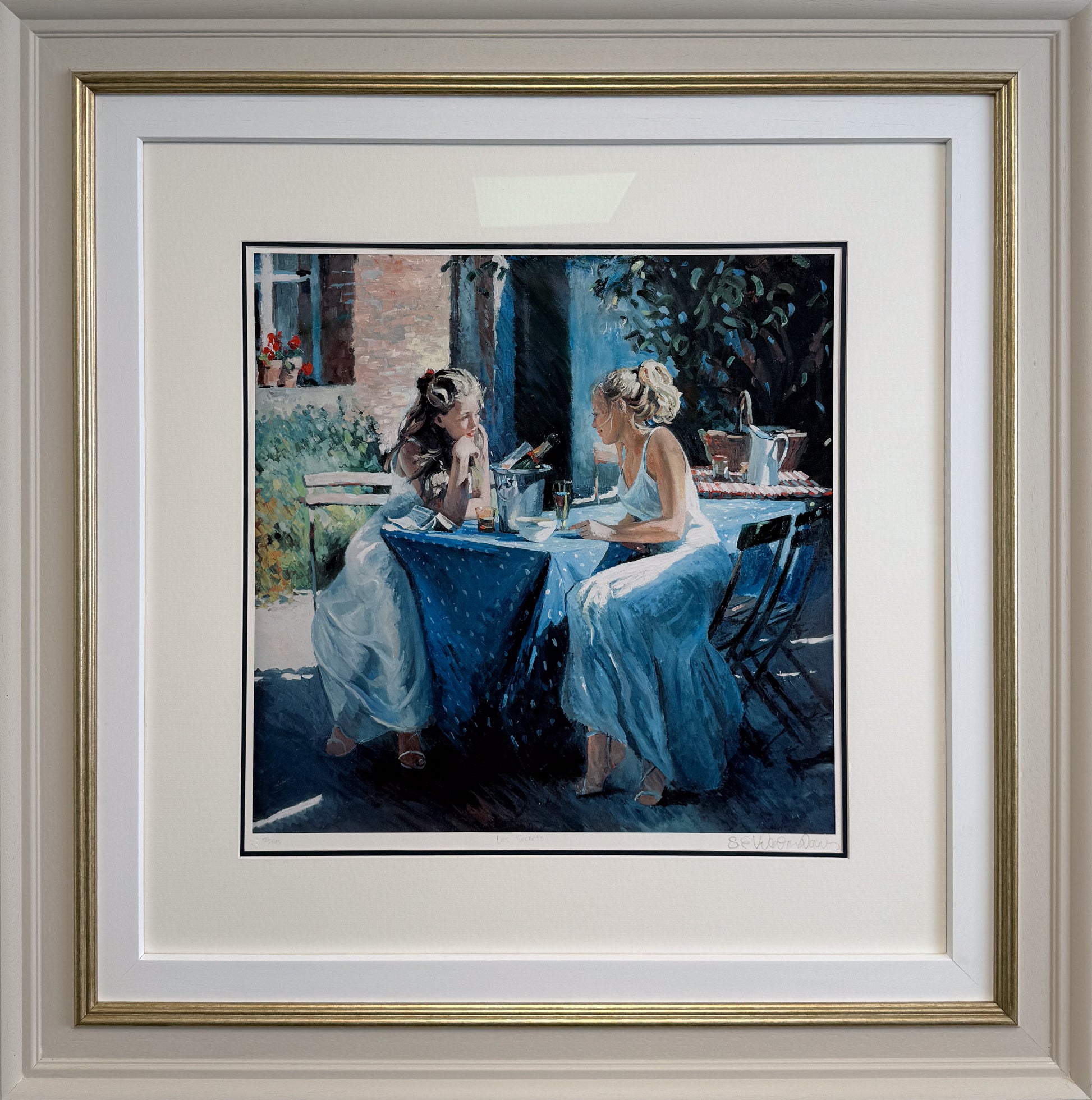 Framed impressionist painting 'Les Secrets' by Sherree Valentine Daines, showing an intimate social scene in a Parisian cafe setting.