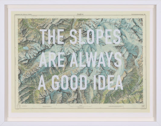 Framed vintage map artwork by The Real Hackney Dave featuring bold blue typography 'The Slopes Are Always A Good Idea,' available at Creed Gallery Ascot