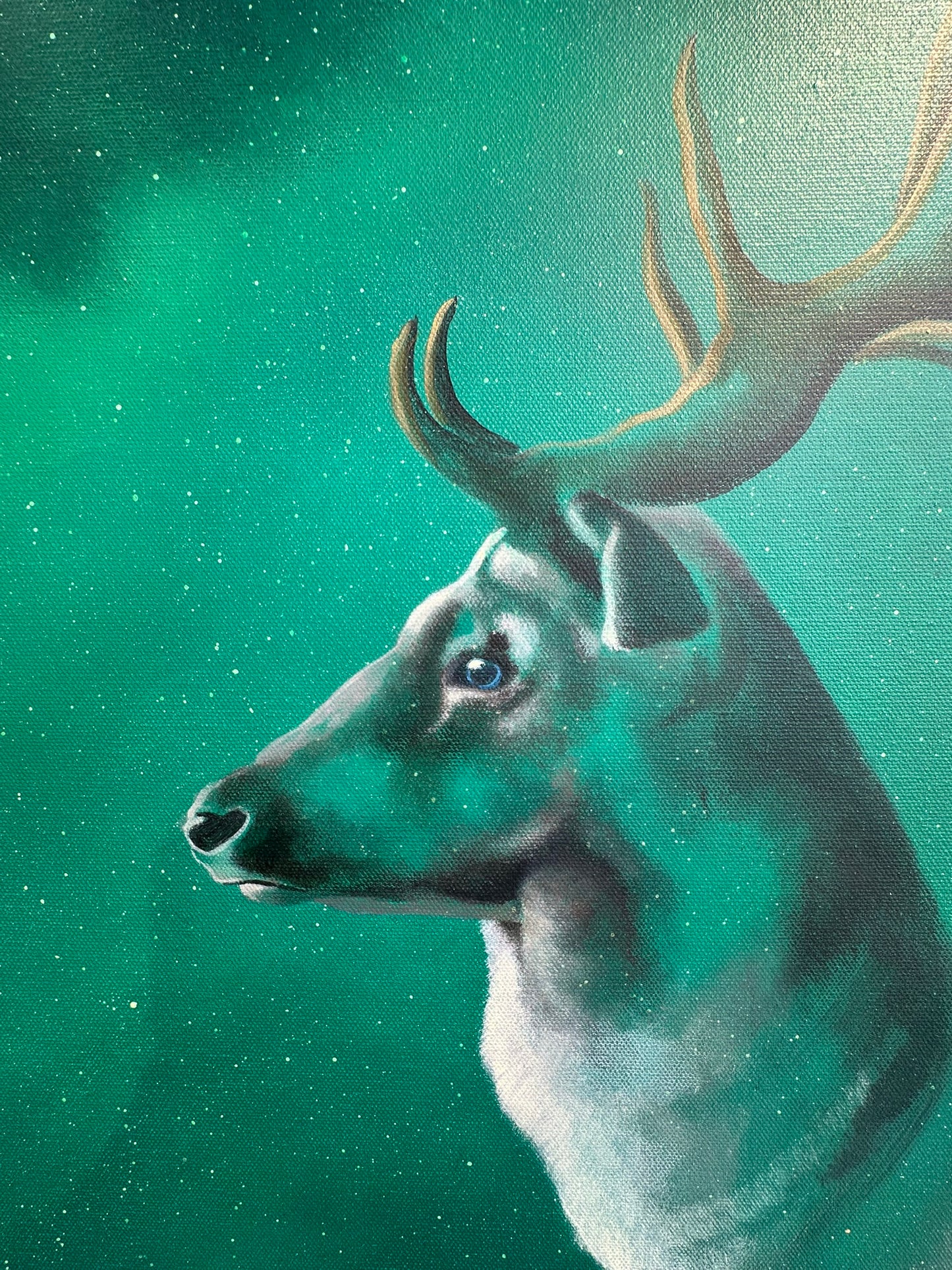 Vincent Devine 'Capella' original painting, close-up detail of the stag's head and golden antlers against a star-filled green sky. Creed Gallery, Ascot.